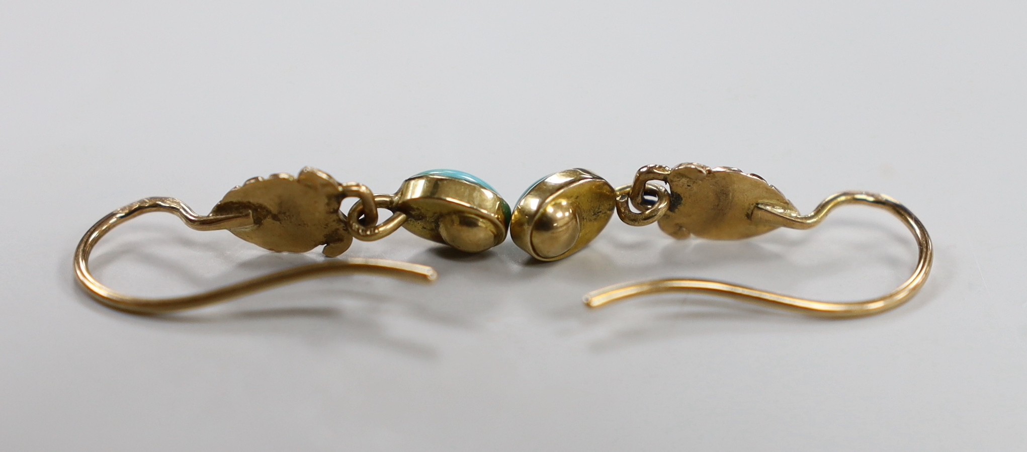 A pair of early 20th century French yellow metal (18ct poincon mark), turquoise and seed pearl set drop earrings, 18mm, gross weight 2.3 grams.